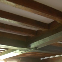 Ceiling beams in the main, panelled, room