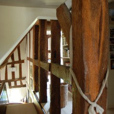 The intricate pattern of beams on the landing  originally housed a dividing wall.