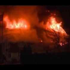 A second image of the thatch of Brook Cotttages ablaze