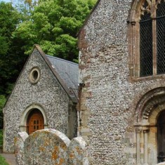 The Church Room, added in 2000. The west doorway of the church is Norman/Romanesque. 