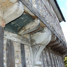 The close-studding and jettied overhang of the structure created in the 1580s. The extravagant use of wood was a sign of the house's rich owner.