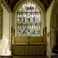 The East Window, designed by Comper as a memorial of World War II. (See details in 'East Window' page.)