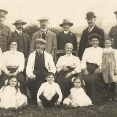 Family Group with two men in army uniforms (WWI?)
