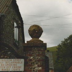 The gateway and sign of the post-war garage.
