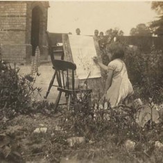 Girl painting in garden