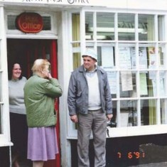 John and his mother Muriel Emptage outside Post Office, Judy Barber behind. 