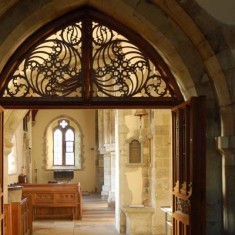 Woodwork over the doorway to the Lady Chapel, also the design of Ninian Compler