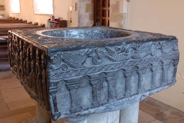 The Tournai font, originally placed in the south transept but moved to the west end when the transept was rebuilt.