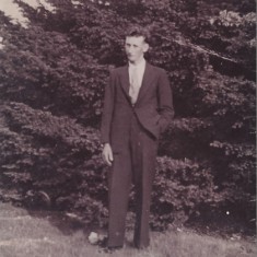 Reg Files in suit in field Reg Files as a young man, in suit.