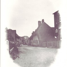 Vignette of High Street. This appears to have been photographed before the 1910 fire which devastated this end of the High Street.