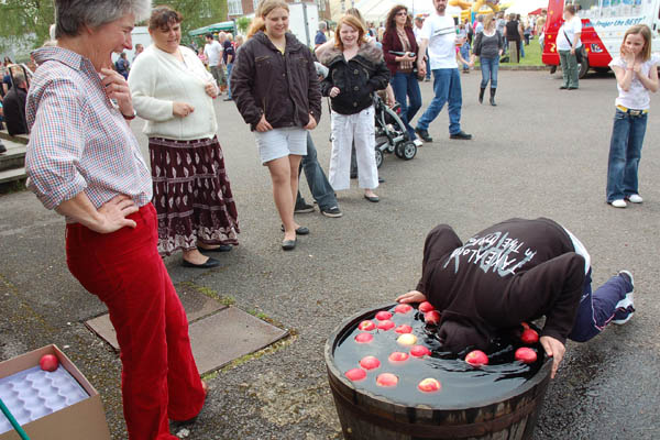 Apple bobbing, supervised by Clare Bartlett.
