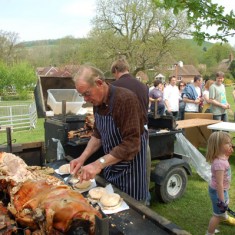 Local farmer Frank Moffatt carving the hog roast, which is provided by another farmer, Matt Atkinson.