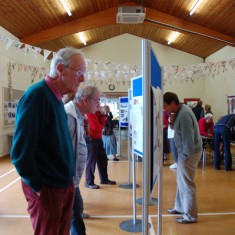 House History panels, History Group member Tony Norman viewing.