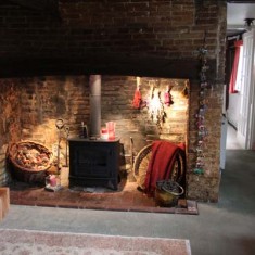 Kitchen side of Fireplace, with bread oven inset into side wall.