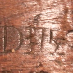 The initials 'RD' carved on mantel beam, probably standing for Richard Dance.