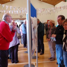 Visitors examining the House History screens.