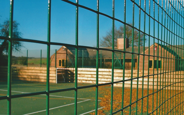 The Soccer Pavilion, through the fence of the multisports pitch.