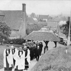 The Rev Saunders (left) leading funeral procession