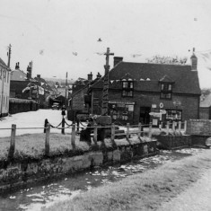 River Meon, G.H. Pink store and war memorial covered in bunting