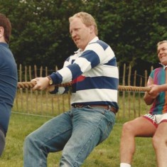 Rory Bremner, then living in East Meon, invited Scottish International rugby players to join his team in the tug-of-war