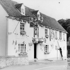 The George Inn - bunting being put up.