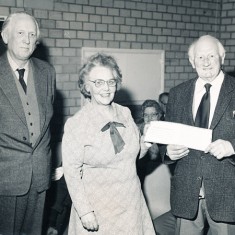 Mrs Tucker makes presentation to Herbie Goddard (right)