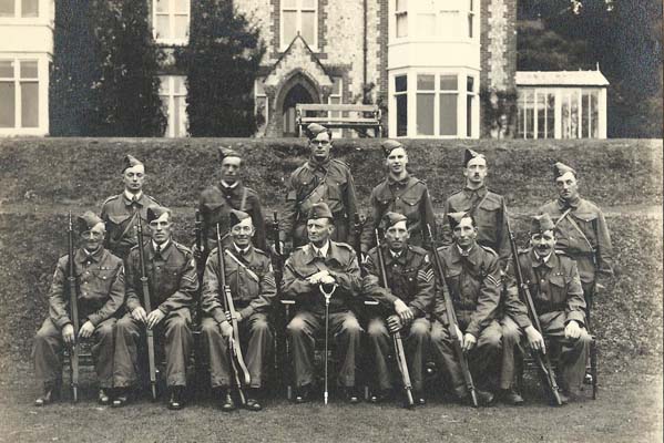 The Commanding Officer (Frank Collyer) and the NCOs of the Home Guard.