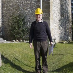Martin Harbord with hard hat and papers 