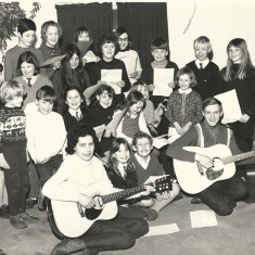 Little Folk singing group. Nigel Lambert with guitar, front right. Bridget Lambert third from left, back row. February 1969.