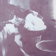 Jane Wren, wife of the farmer at Riplington, works butter to remove buttermilk, 1908 - 1910 