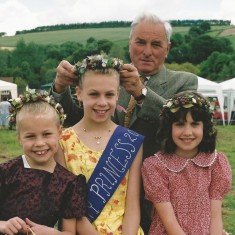 Wilson Atkinson crowns Emily Cross as May Queen, with her sister Amy in attendance (left)