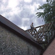 Denys sawing away at rafters.