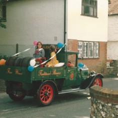 Decorated truck in procession past Bell Cottage