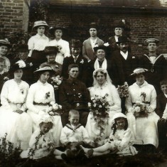 Information from Denise Moody: They both came from large families but no one has a clue who the other people are in the photo except Granny and Grandad Bone, he is in his army uniform and of course Granny in her wedding dress plus both sets of parents - Grandad Bones behind him with his Mum to the left and his Dad beside her further to the left. Granny Bone's parents are directly behind the bride and groom. 