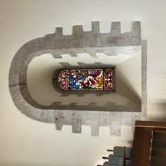 Romanesque window with earth 20th century glass on north wall of nave | Richard Gaisford