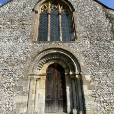 Romanesque arches and zig-zag beading on West Door.