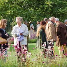 Sylvia Brindley and visitors in Bottle Cottage garden Sylvia Brindley and visitors in Bottle Cottage garden